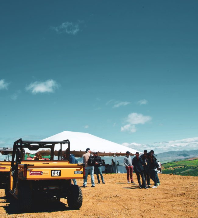 Group of people with tent and ATVs